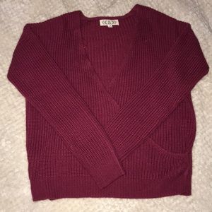 maroon low-cut sweater